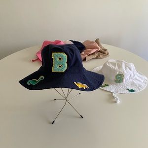 Baby sun hats with initials & 2 patches.